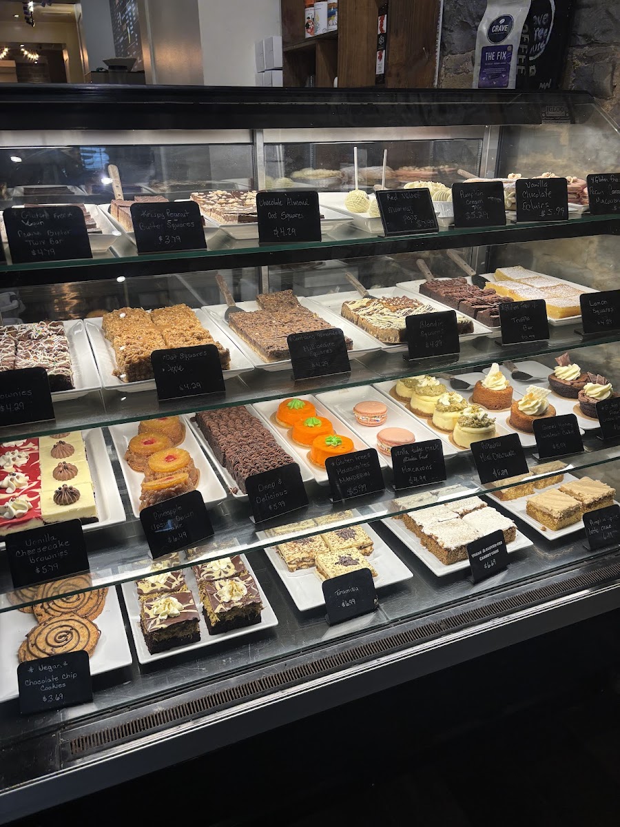 CRAVE’s real pastry case, filled with cinnamon buns, bars and cakes